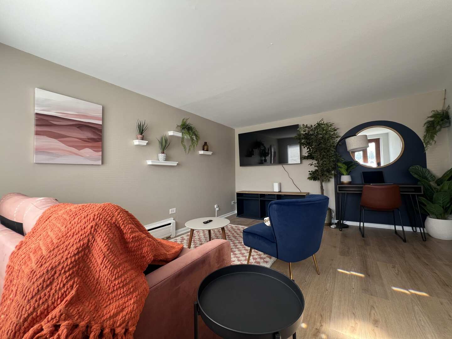 912 East St Charles Road Lombard, IL 60148 - Photo 18 of 27 a living room with furniture a mirror and a wooden floor