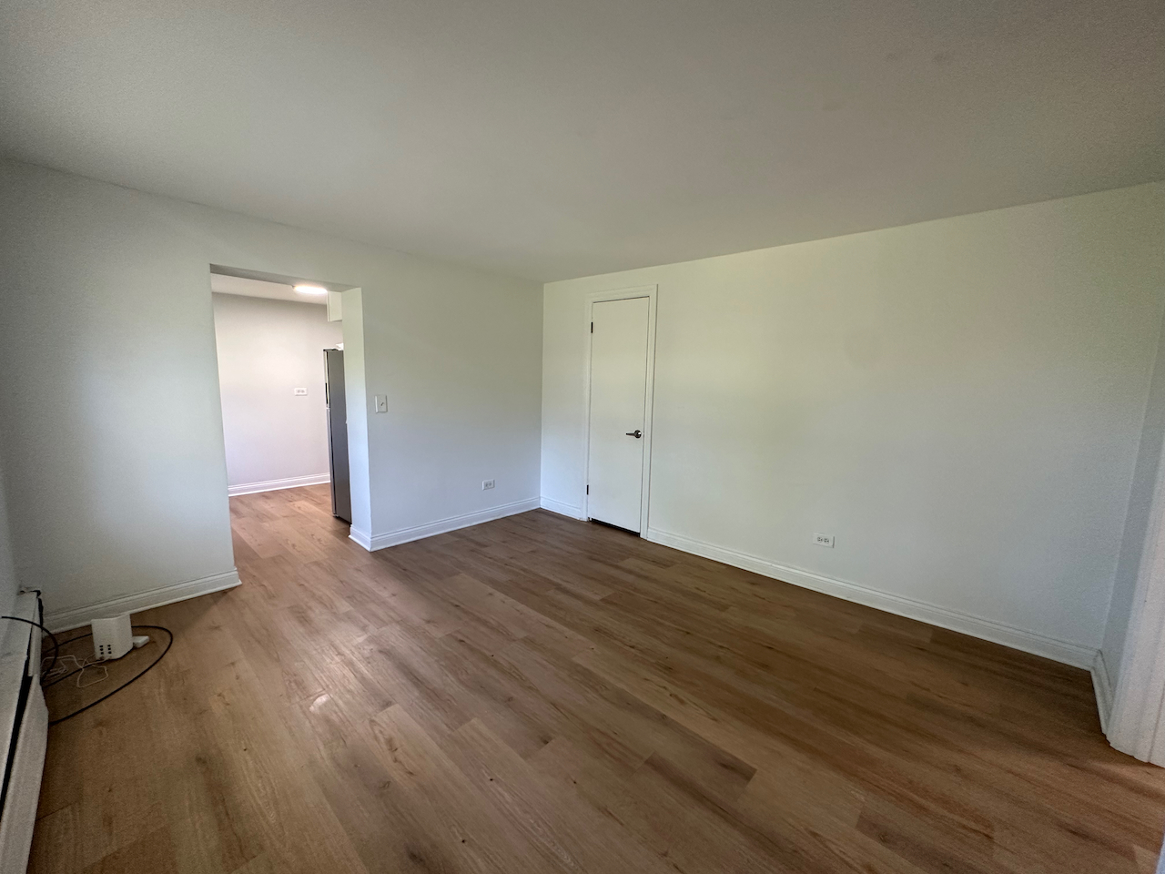912 East St Charles Road Lombard, IL 60148 - Photo 2 of 27 a view of a room with wooden floor