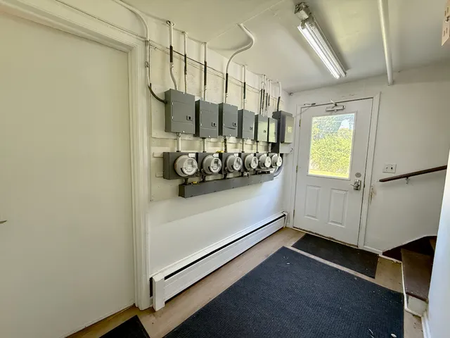 a view of a room with rack on the wall and a window