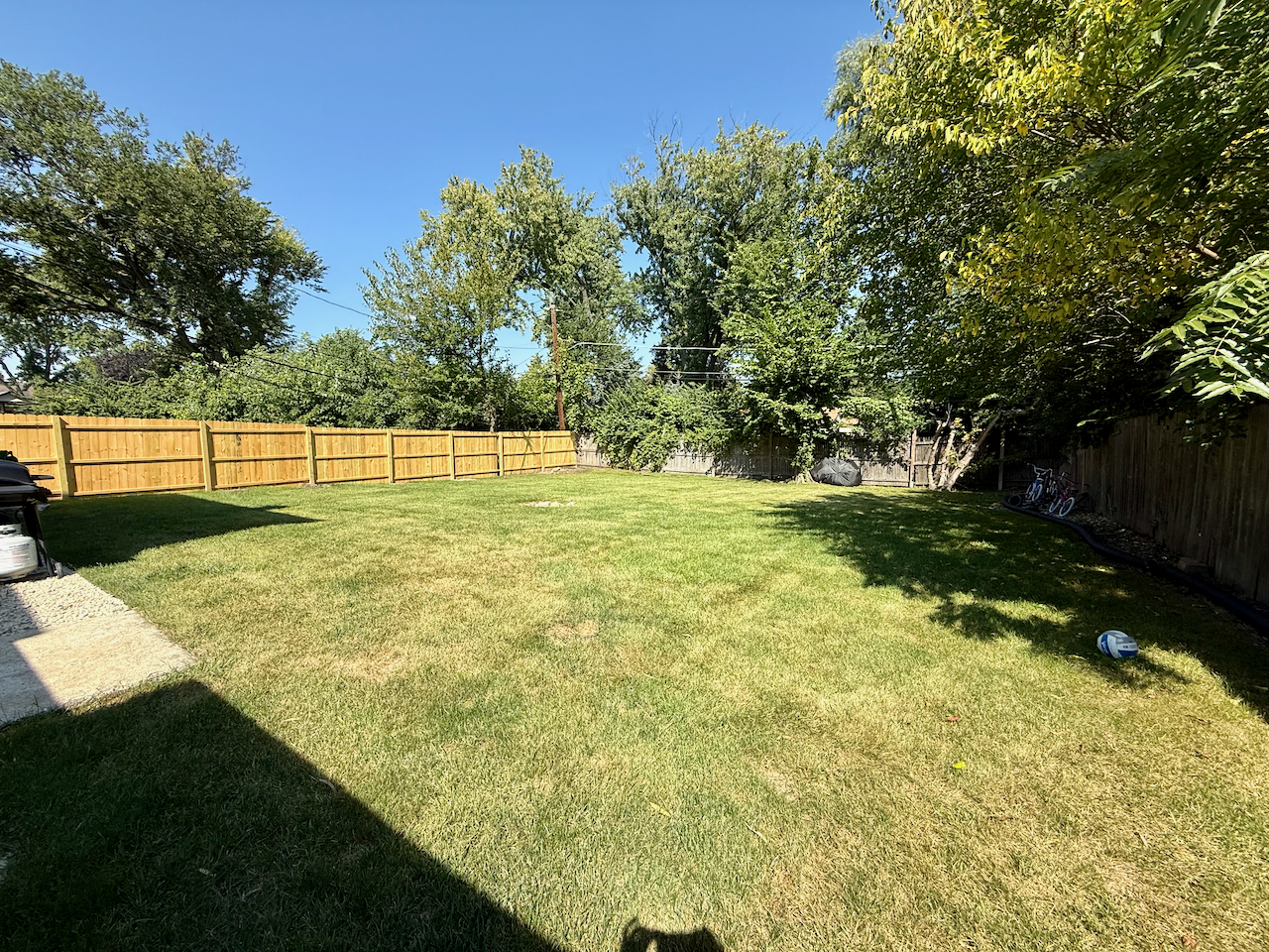 912 East St Charles Road Lombard, IL 60148 - Photo 27 of 27 a swimming pool with wooden fence