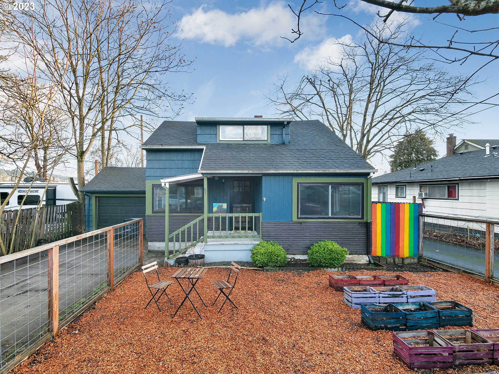 8034 Southeast Henderson Street Portland, OR 97206 - Photo 1 of 23 a front view of a house with garden