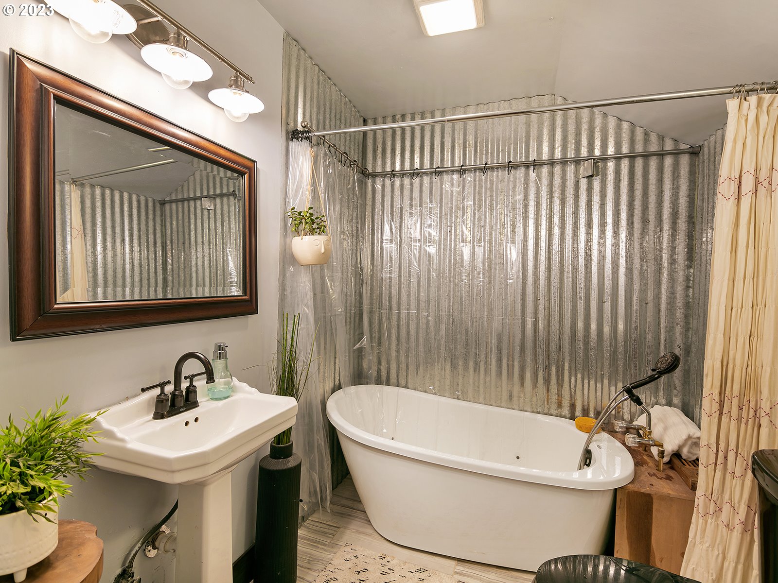 8034 Southeast Henderson Street Portland, OR 97206 - Photo 11 of 23 a bathroom with a sink and a mirror