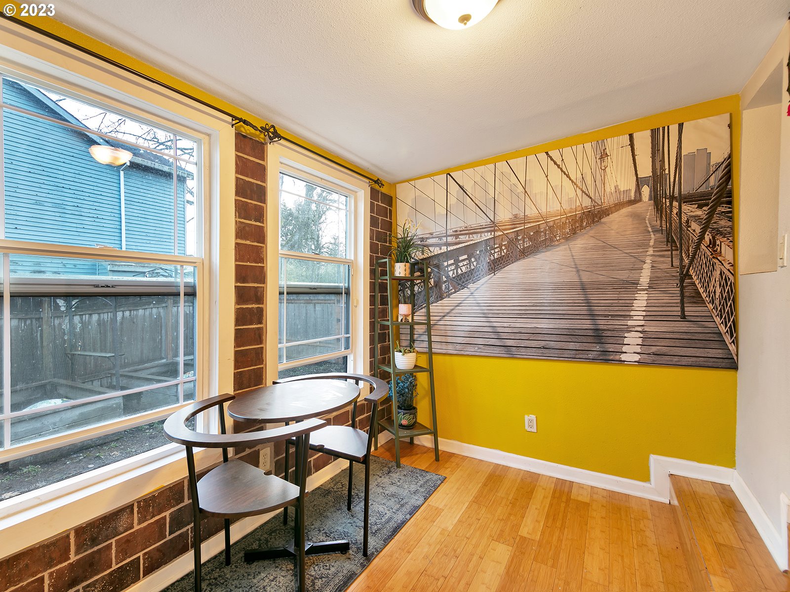 8034 Southeast Henderson Street Portland, OR 97206 - Photo 12 of 23 a balcony with table and chairs