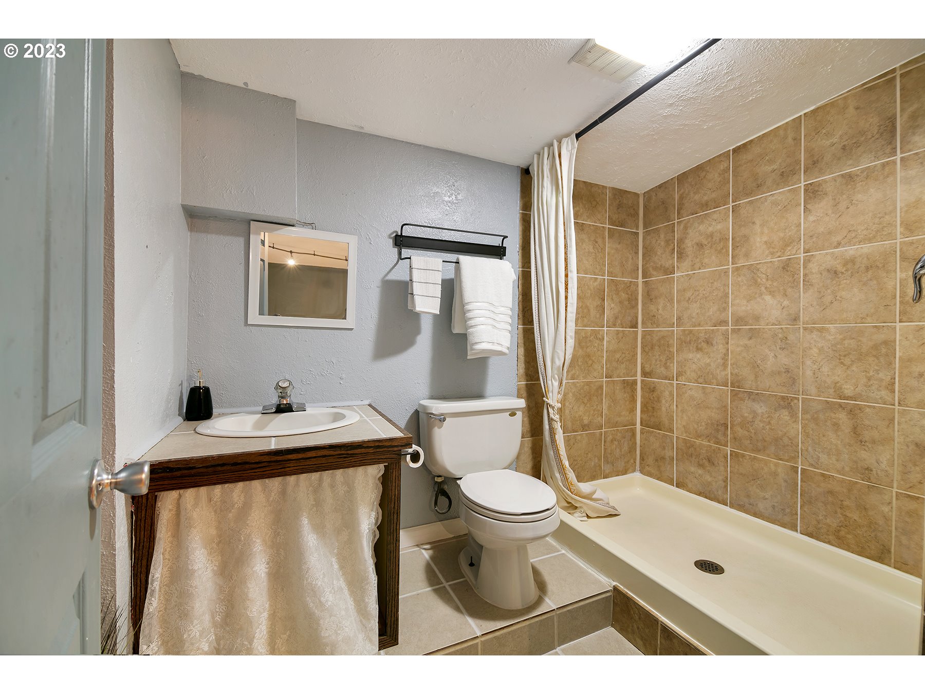 8034 Southeast Henderson Street Portland, OR 97206 - Photo 22 of 23 a bathroom with a sink toilet and shower