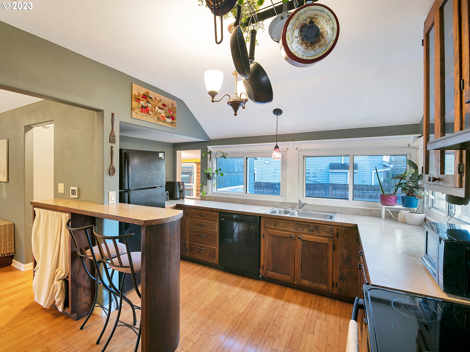 8034 Southeast Henderson Street Portland, OR 97206 - Photo 5 of 23 a kitchen with a sink and cabinets