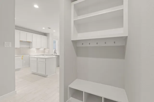 a bathroom with a sink a toilet and vanity