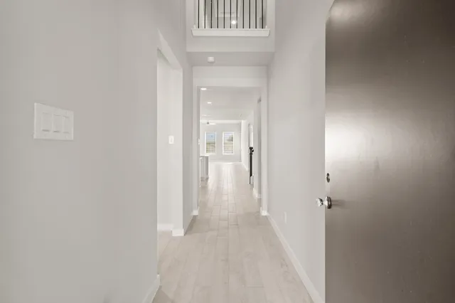 a view of a hallway with a white walls