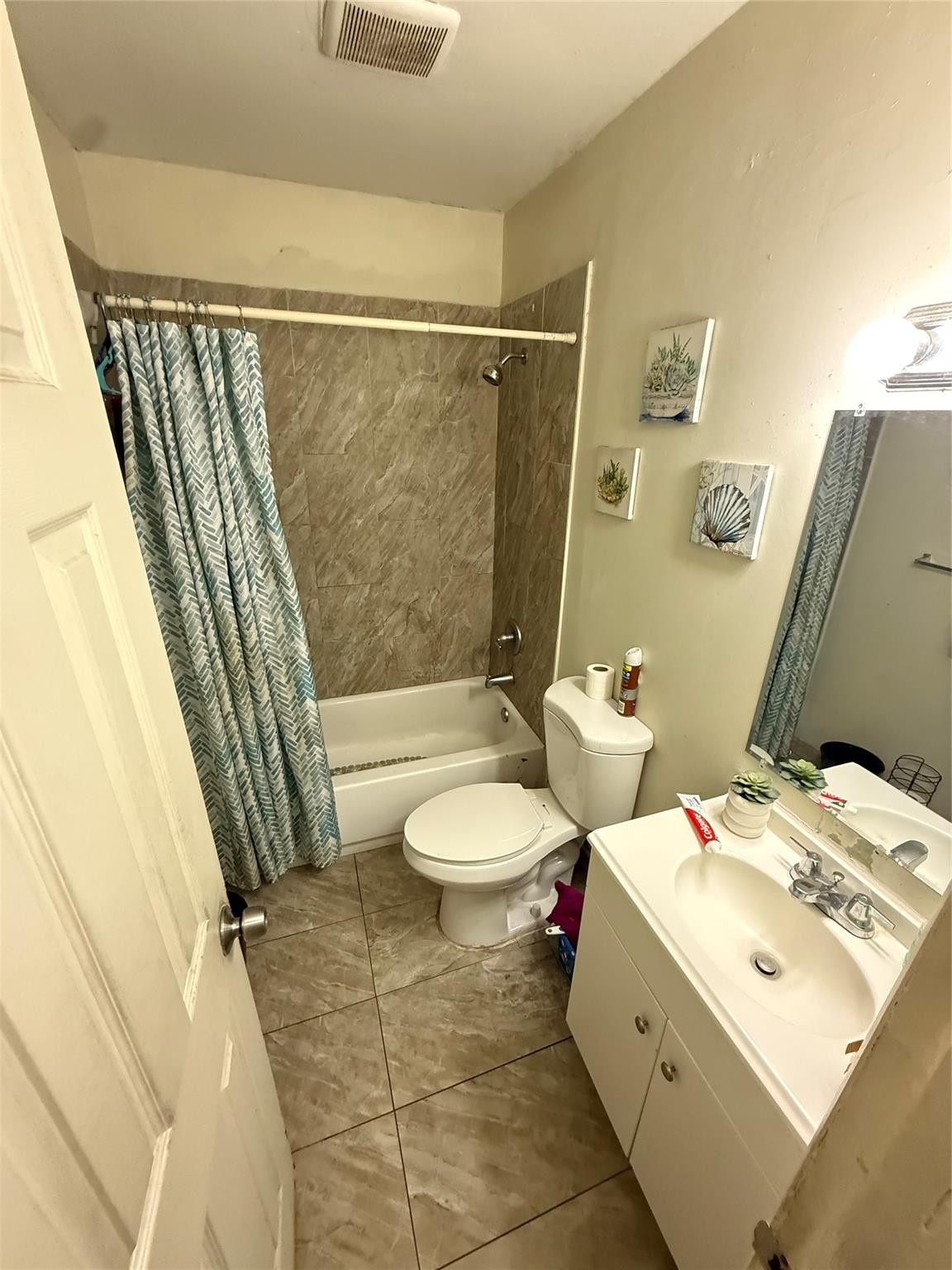 1028 Northwest 24th Street Miami, FL 33127 - Photo 16 of 24 a bathroom with a sink toilet and shower