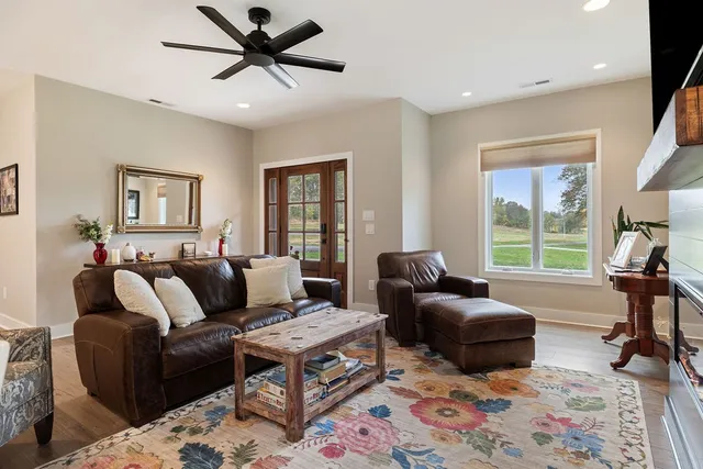 a living room with furniture and a window