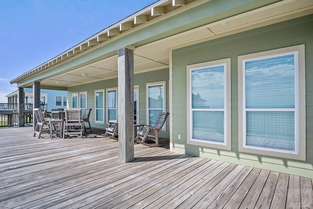 437 Atkinson Street Crystal Beach, TX 77650 - Photo 25 of 40 a view of a house with porch and patio