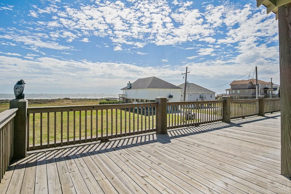 437 Atkinson Street Crystal Beach, TX 77650 - Photo 26 of 40 a view of a balcony with wooden floor