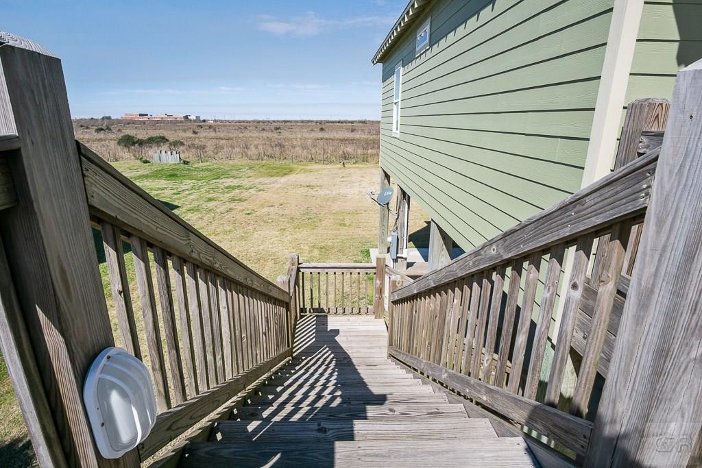 437 Atkinson Street Crystal Beach, TX 77650 - Photo 30 of 40 a view of balcony with staircase