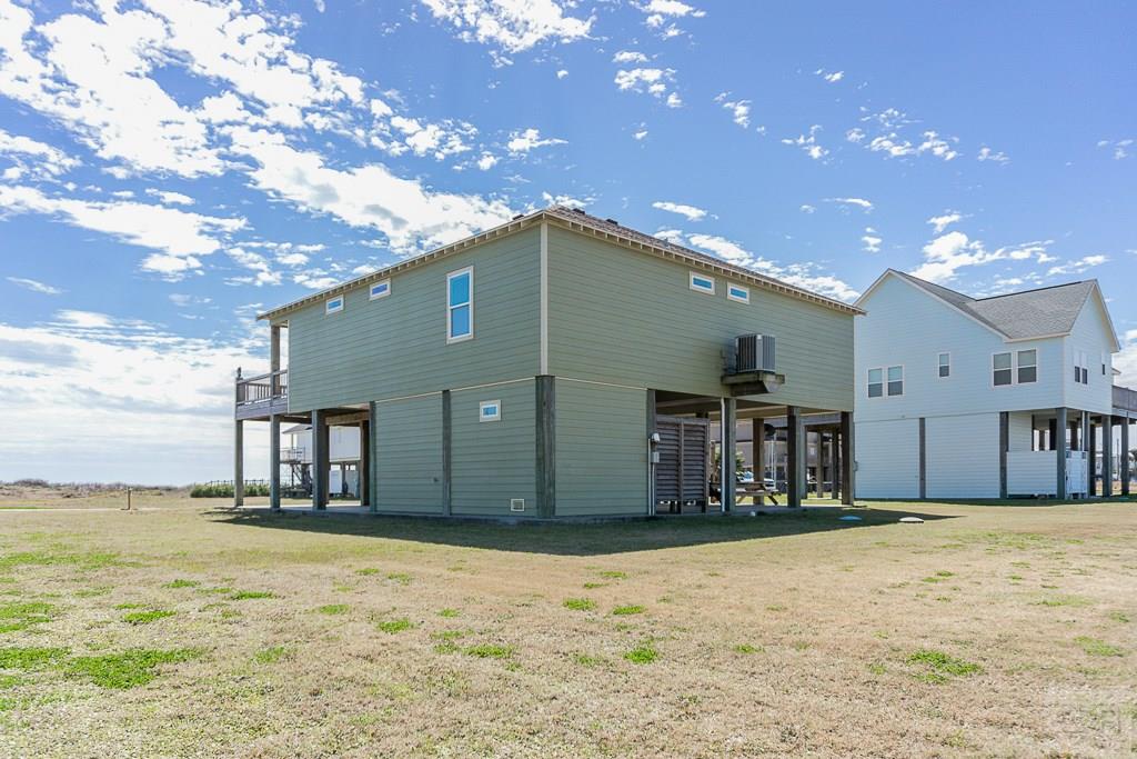 437 Atkinson Street Crystal Beach, TX 77650 - Photo 37 of 40 a front view of a house with a garage