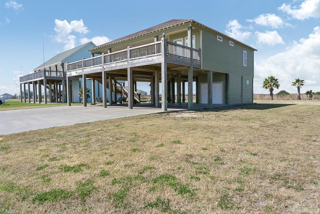 437 Atkinson Street Crystal Beach, TX 77650 - Photo 39 of 40 a front view of a house with a yard