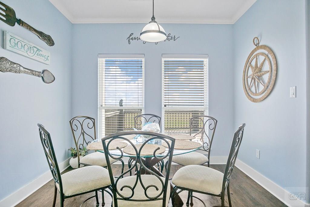 437 Atkinson Street Crystal Beach, TX 77650 - Photo 8 of 40 a dining room with furniture and window