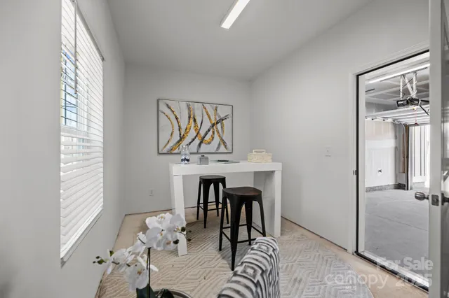 a workspace with furniture and window