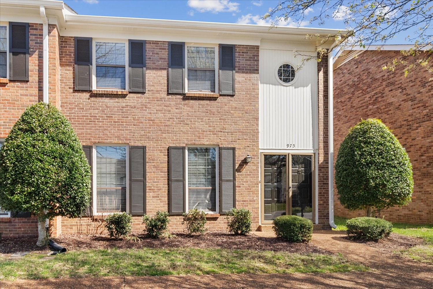 975 General George Patton Road Nashville, TN 37221 - Photo 2 of 32 a front view of a house with garden