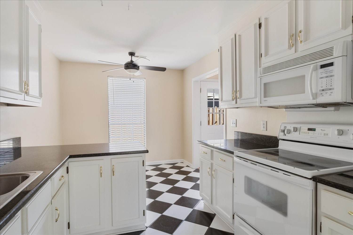 975 General George Patton Road Nashville, TN 37221 - Photo 3 of 32 a kitchen with stainless steel appliances granite countertop a sink and a stove