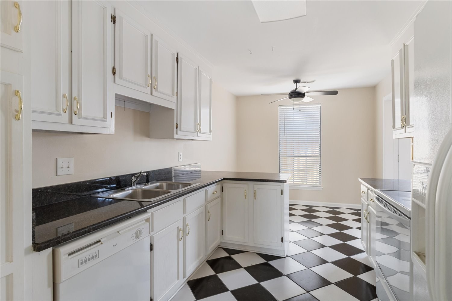 975 General George Patton Road Nashville, TN 37221 - Photo 5 of 32 a kitchen with a sink a stove and cabinets