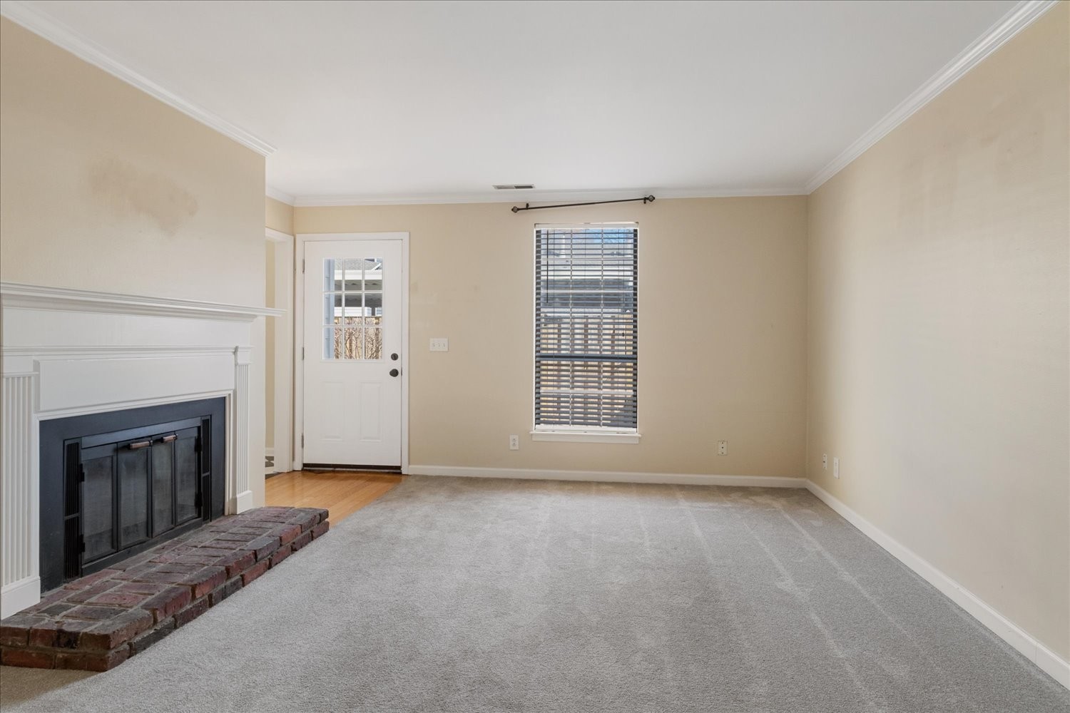 975 General George Patton Road Nashville, TN 37221 - Photo 8 of 32 a view of an empty room with a fireplace and a window