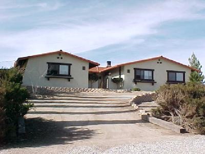 20006 Waco Road Apple Valley, CA 92308 - Photo 1 of 1 a front view of a house with a yard