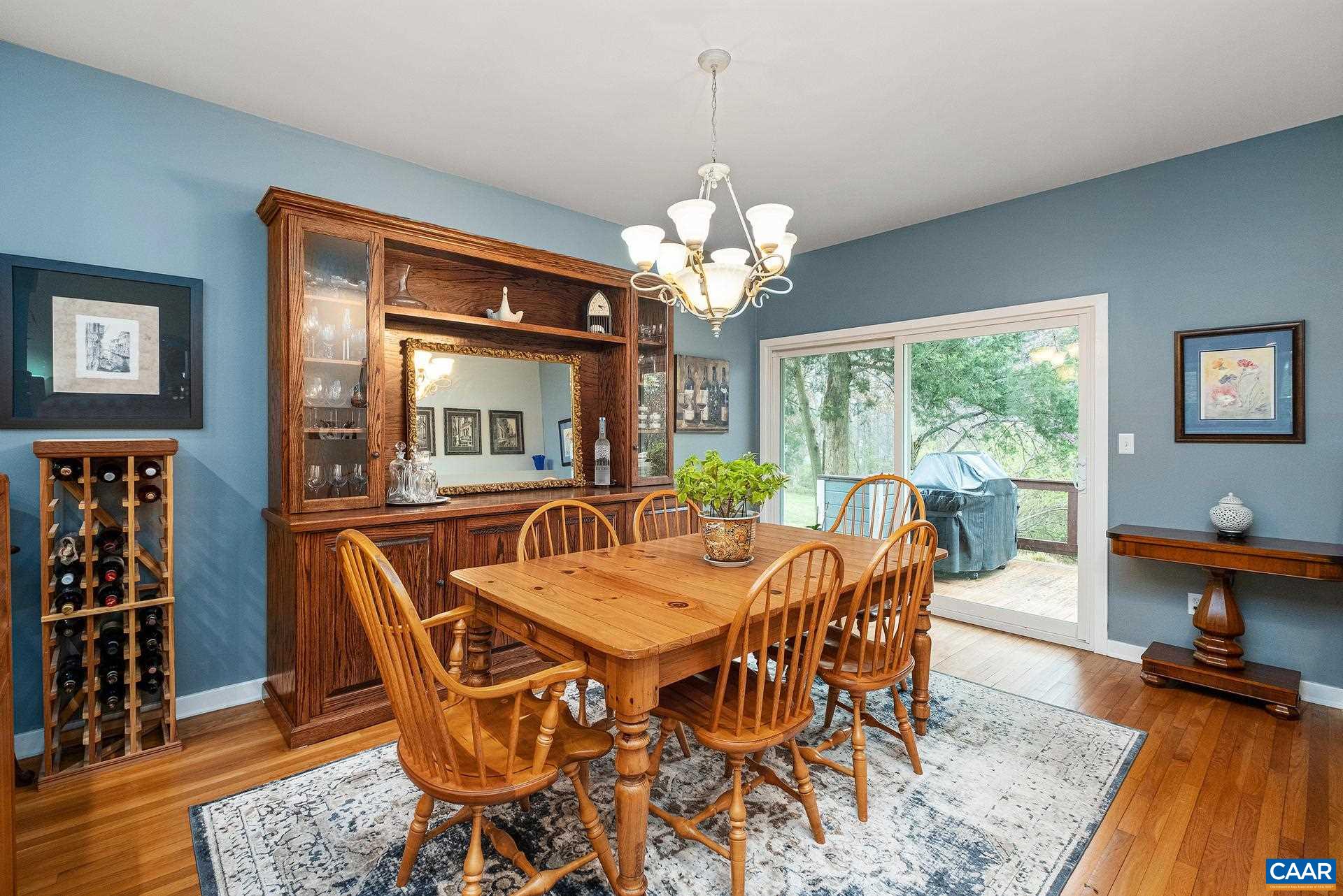 265 Turkey Ridge Road Charlottesville, VA 22903 - Photo 10 of 57 a view of a dining room with furniture window and wooden floor