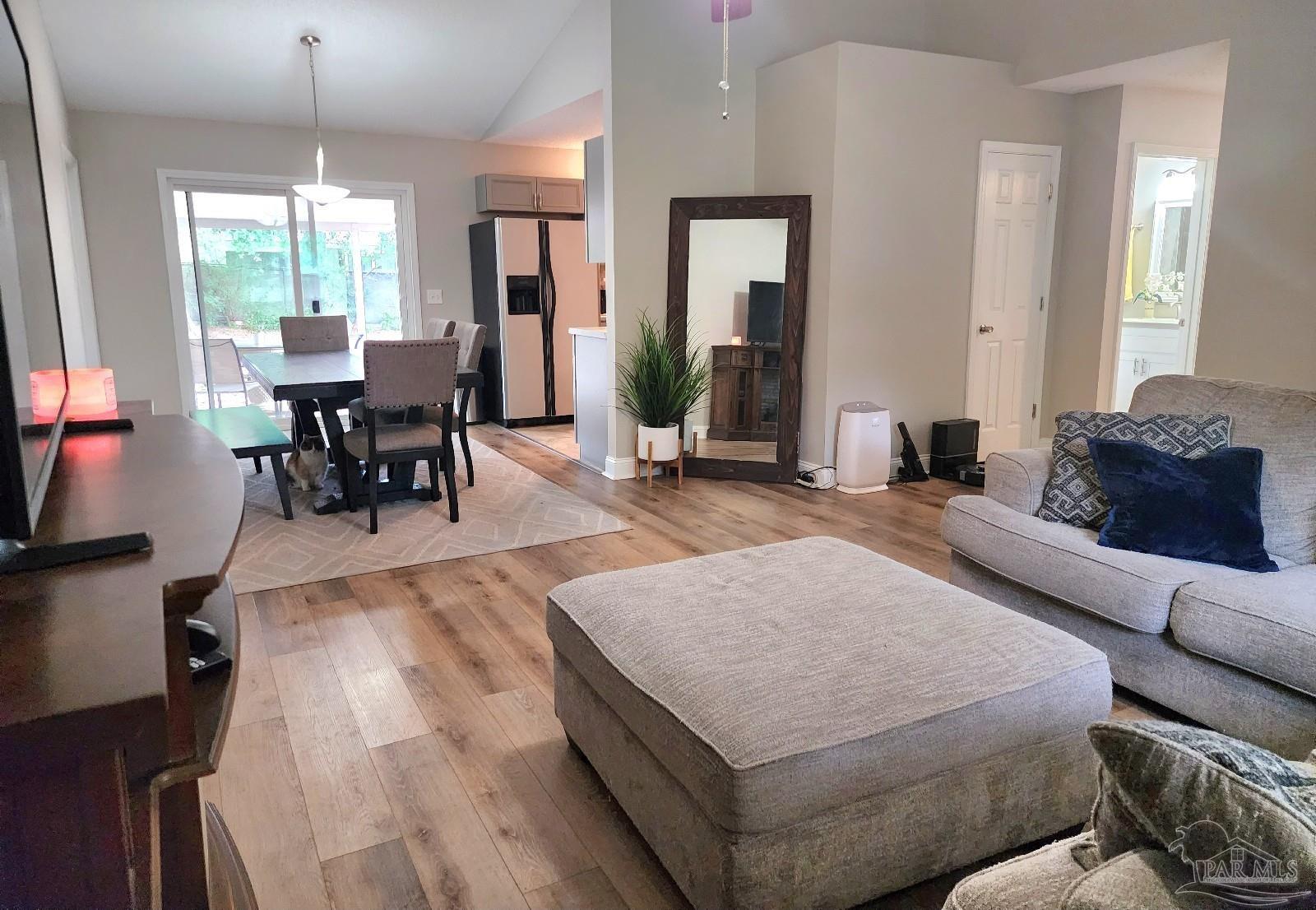 4348 Wellington Drive Pace, FL 32571 - Photo 7 of 20 a living room with furniture and a large window