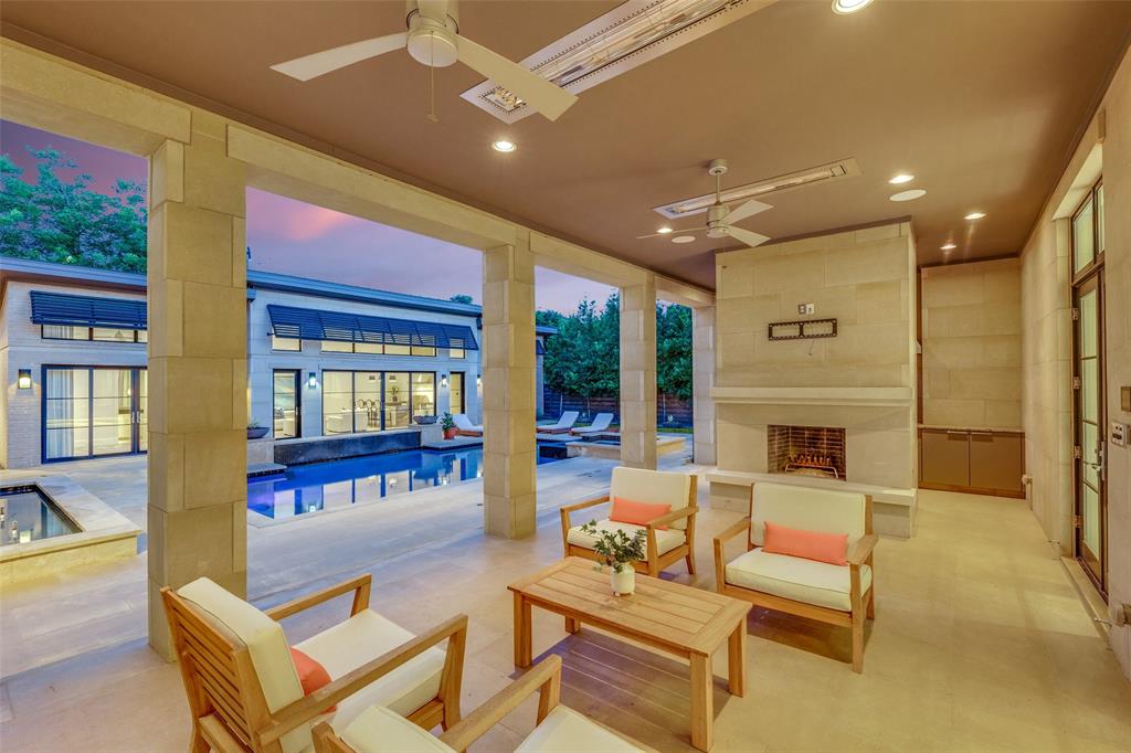 4326 Pomona Road Dallas, TX 75209 - Photo 24 of 31 Patio terrace at dusk featuring an outdoor pool, a patio area, a ceiling fan, and an outdoor living space with a fireplace