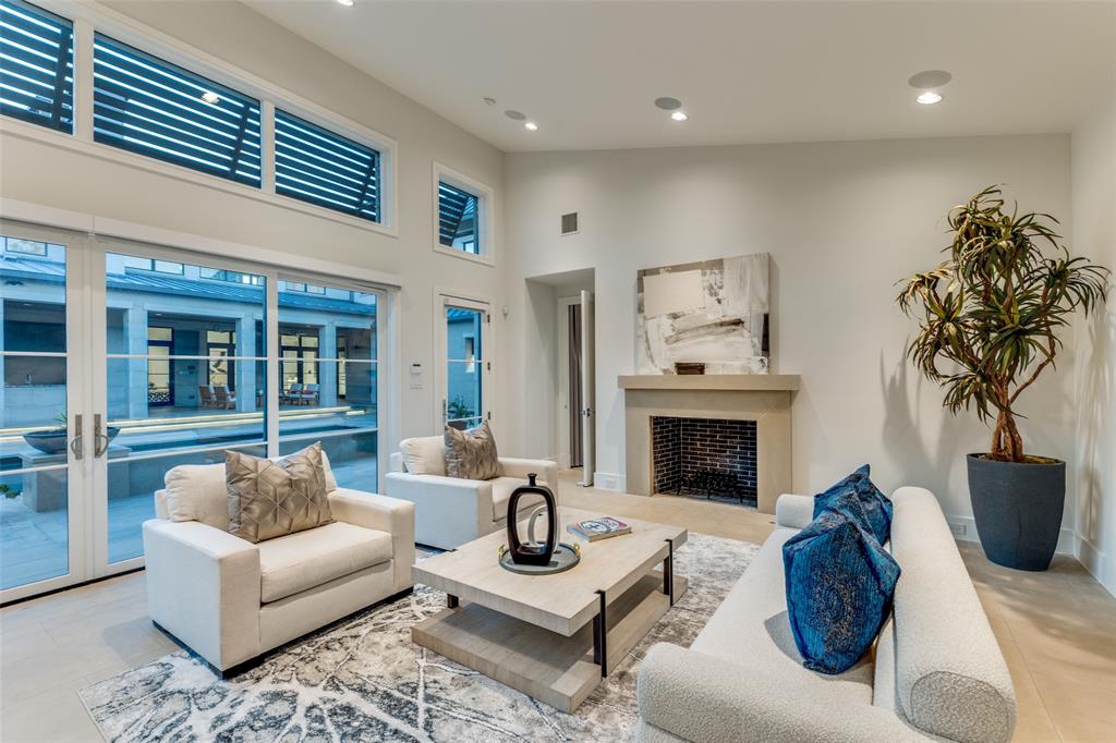 4326 Pomona Road Dallas, TX 75209 - Photo 3 of 31 Living area with a fireplace, high vaulted ceiling, and recessed lighting