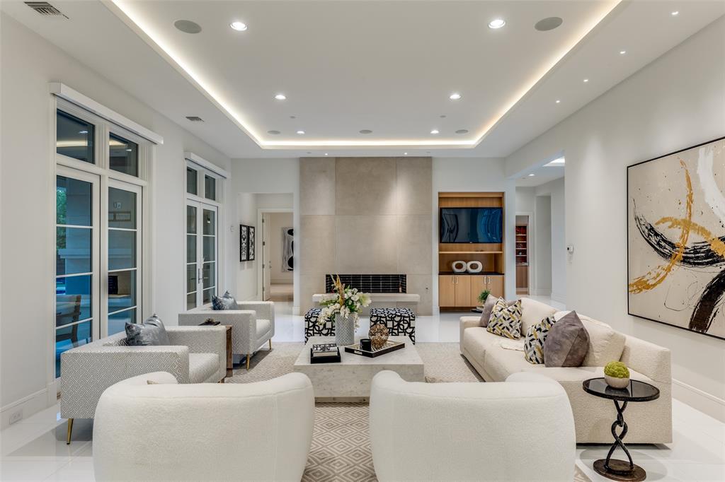 4326 Pomona Road Dallas, TX 75209 - Photo 4 of 31 Living room with a tray ceiling, recessed lighting, and light tile patterned floors