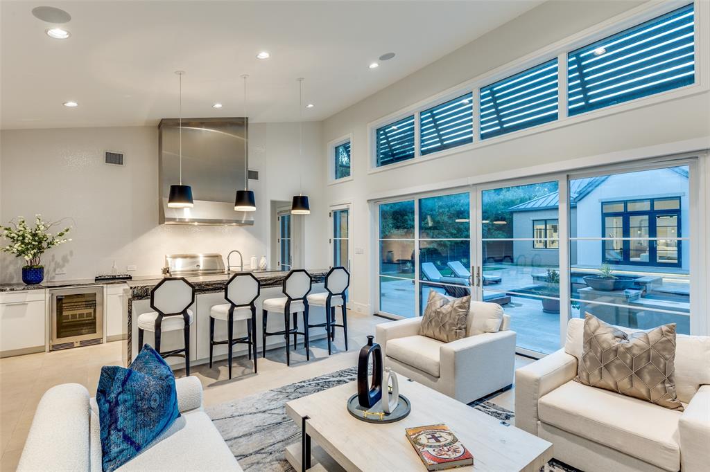 4326 Pomona Road Dallas, TX 75209 - Photo 7 of 31 Living room featuring high vaulted ceiling, wine cooler, and recessed lighting