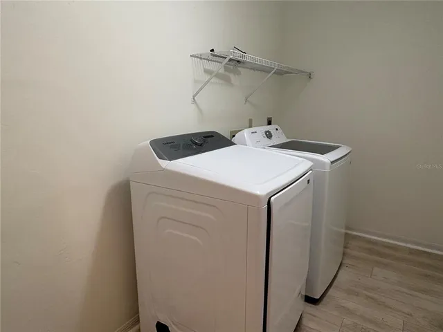a utility room with dryer and washer