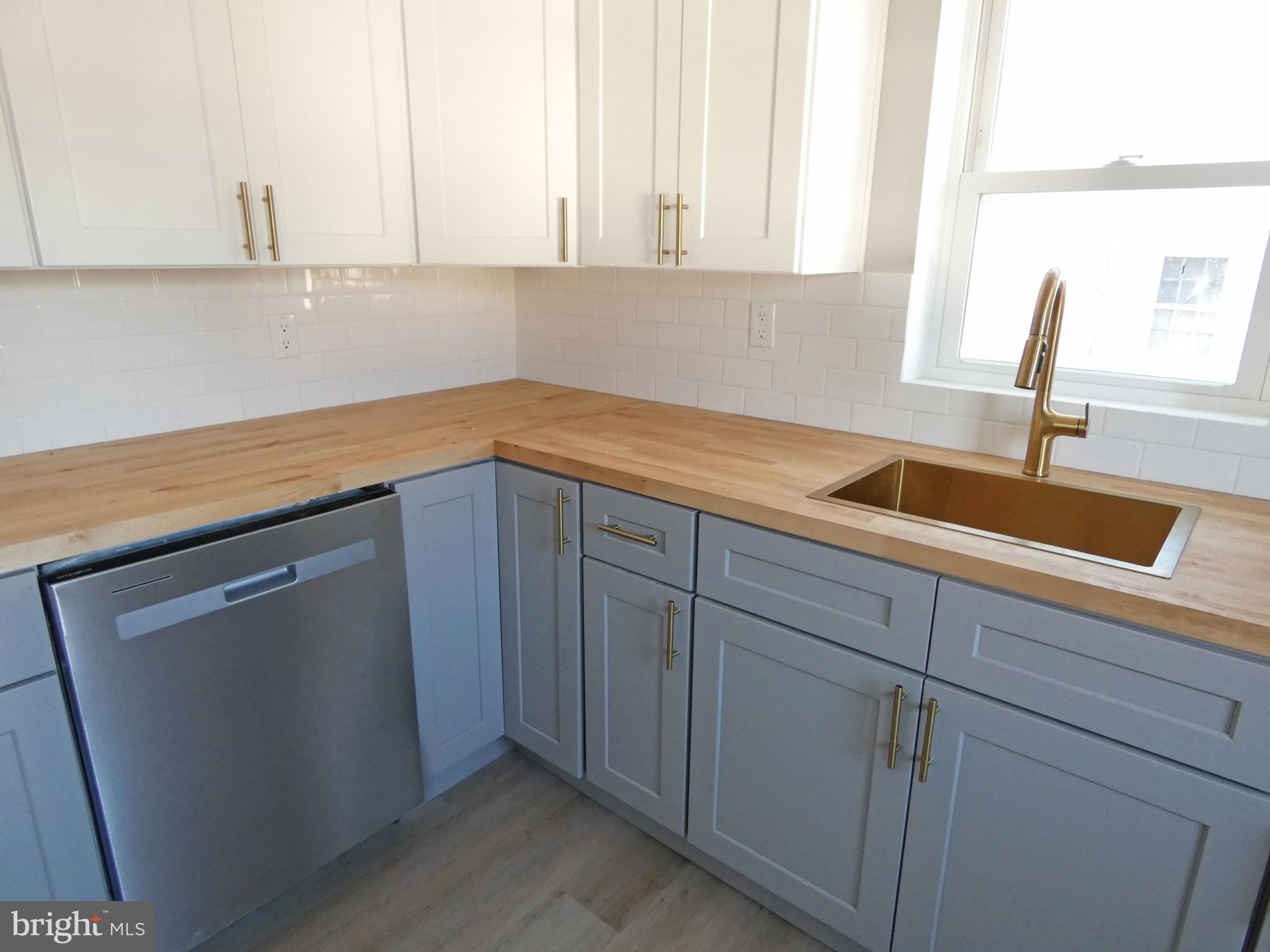 411 Manor Avenue Carneys Point, NJ 08069 - Photo 20 of 50 a kitchen with a sink and cabinets