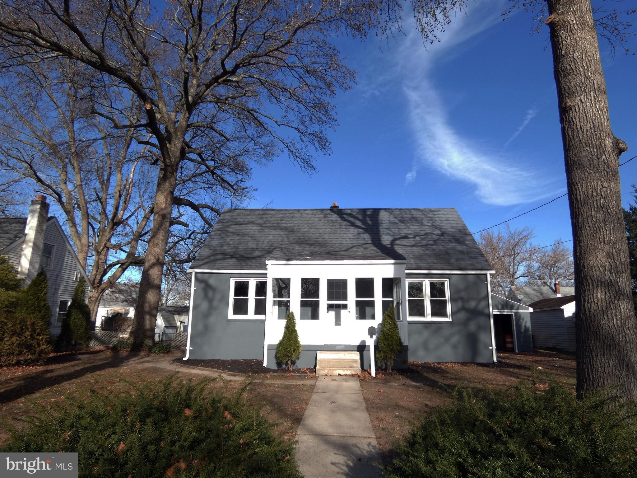 411 Manor Avenue Carneys Point, NJ 08069 - Photo 3 of 50 a front view of a house with a yard