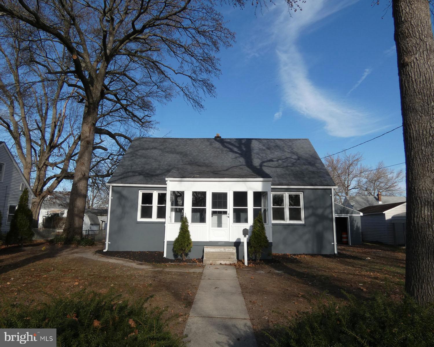 411 Manor Avenue Carneys Point, NJ 08069 - Photo 4 of 50 front view of a house with a yard
