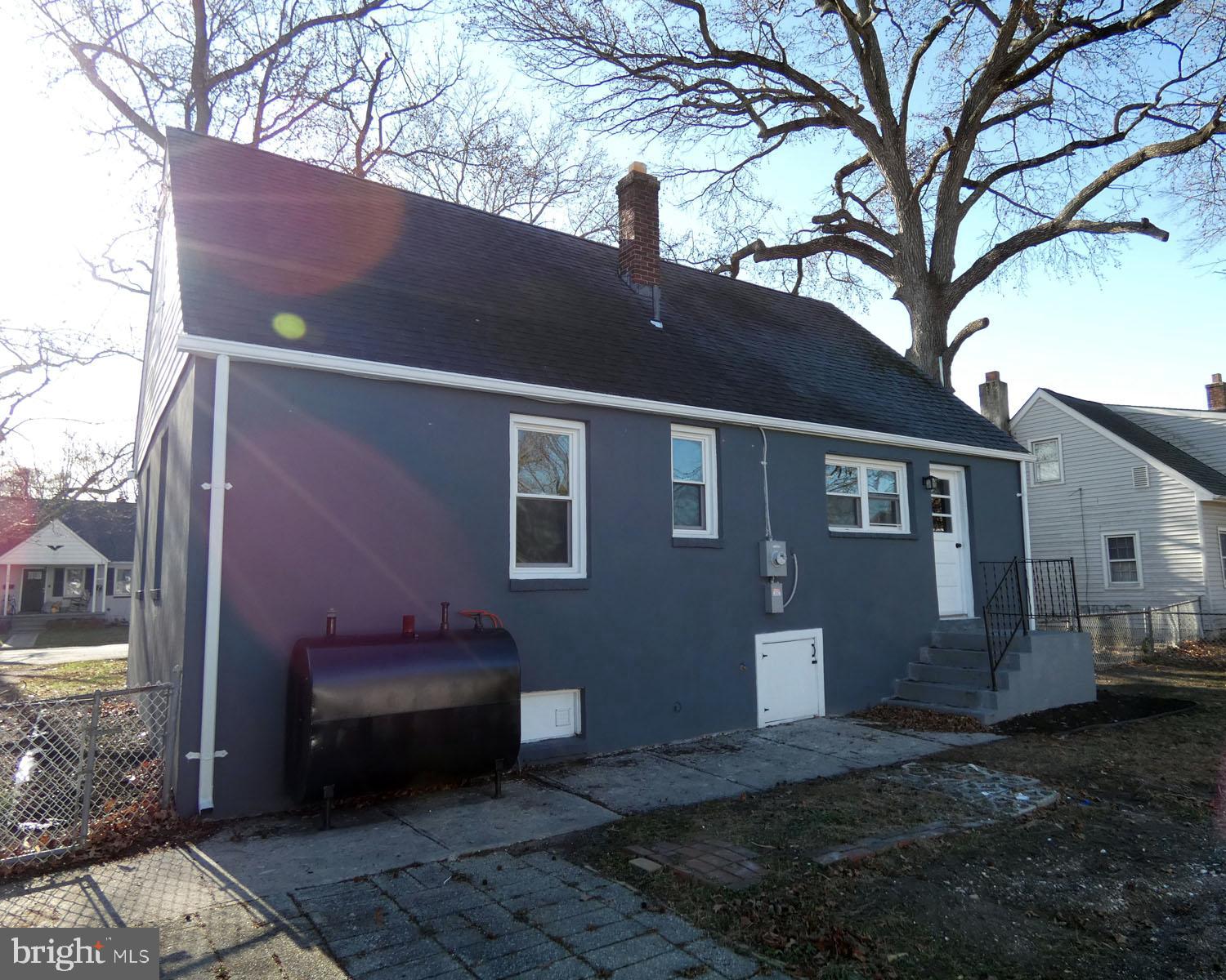 411 Manor Avenue Carneys Point, NJ 08069 - Photo 45 of 50 a backyard of a house with barbeque oven and outdoor seating