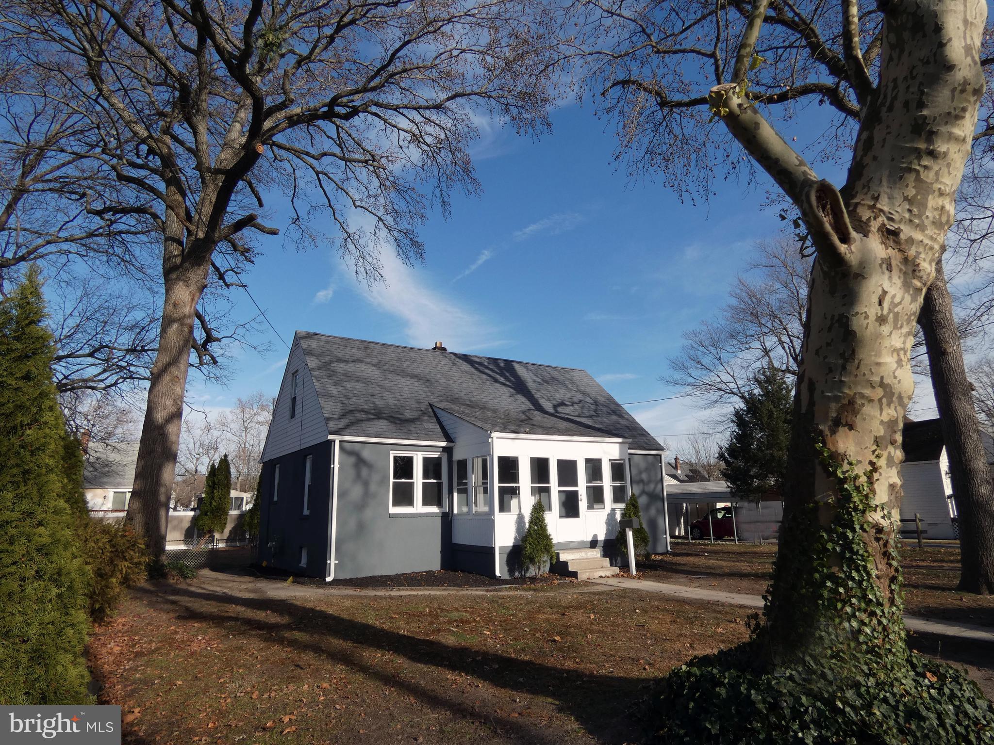 411 Manor Avenue Carneys Point, NJ 08069 - Photo 5 of 50 a front view of a house with a yard