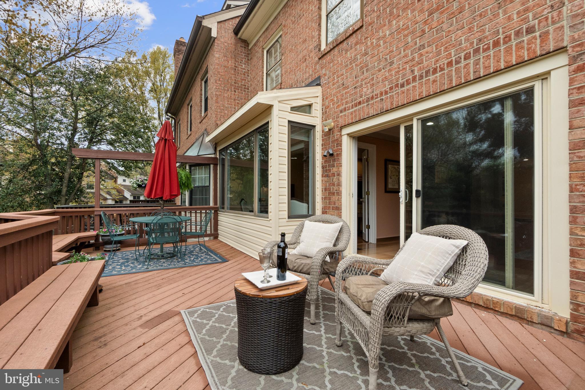 6315 Manchester Way Alexandria, VA 22312 - Photo 15 of 51 a view of a patio with table and chairs and wooden floor