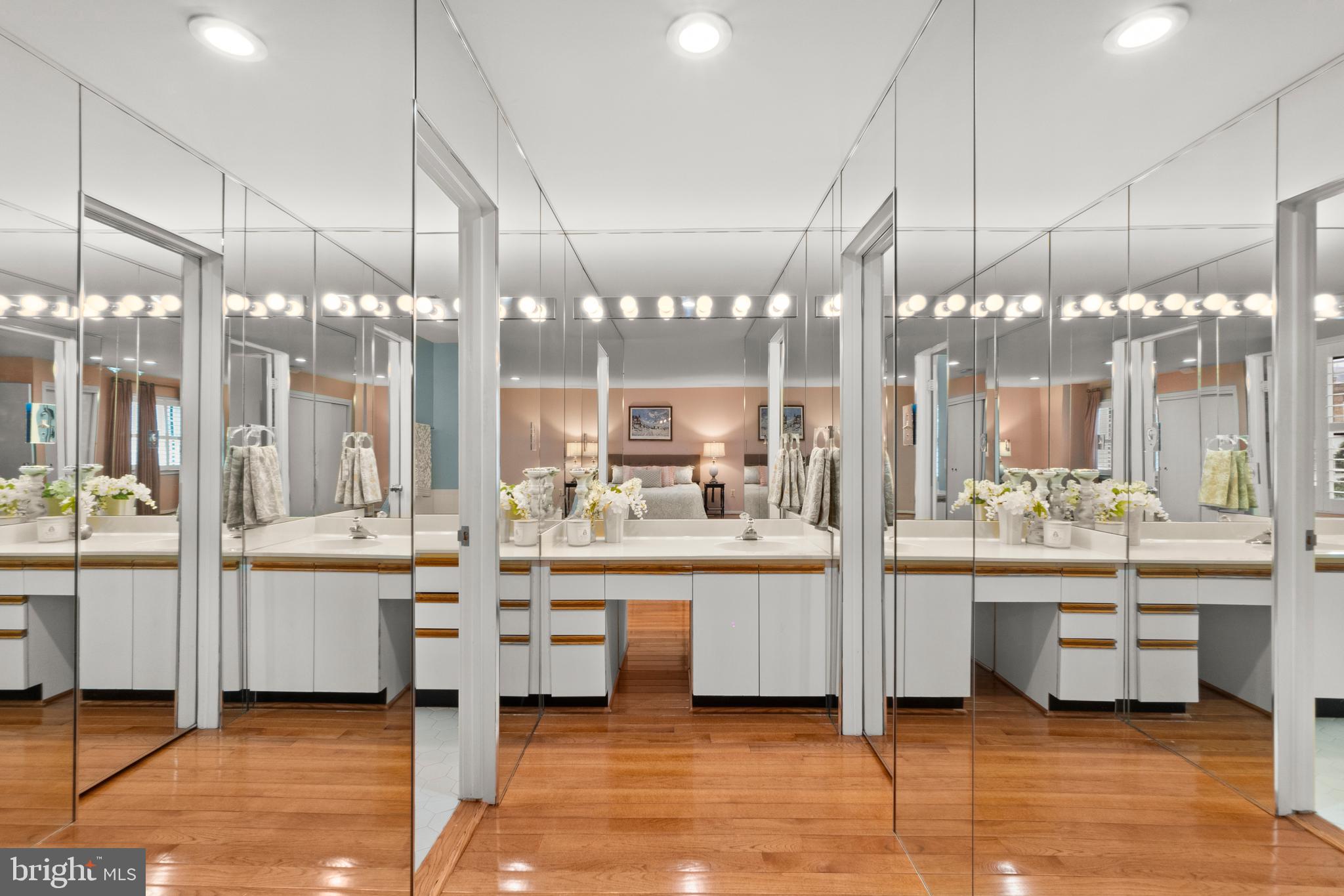6315 Manchester Way Alexandria, VA 22312 - Photo 23 of 51 a large white kitchen with a large glass table and chairs