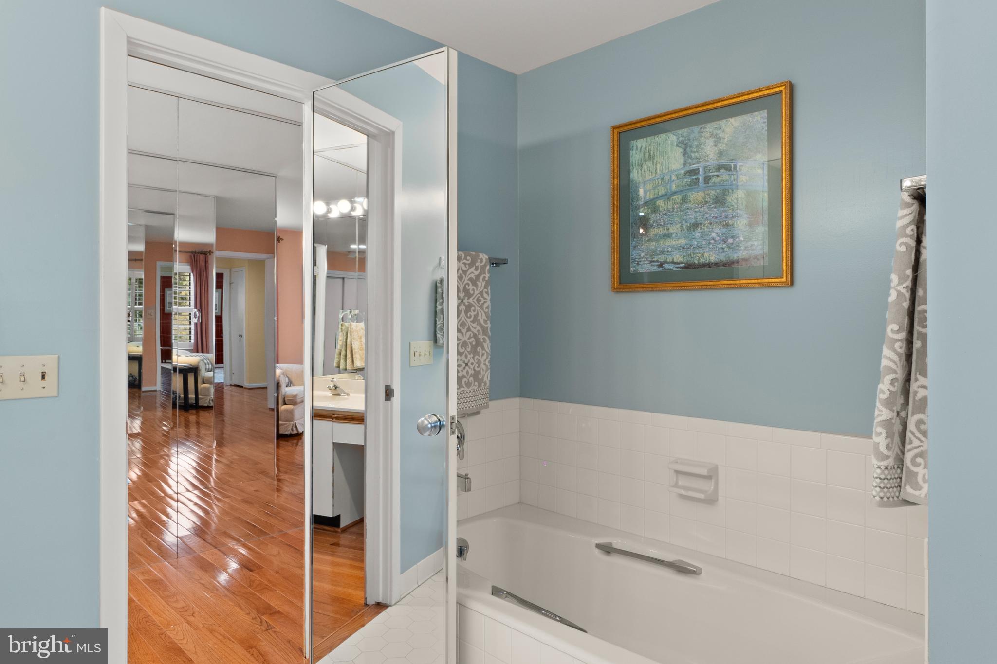 6315 Manchester Way Alexandria, VA 22312 - Photo 25 of 51 a bathroom with a bathtub and a shower