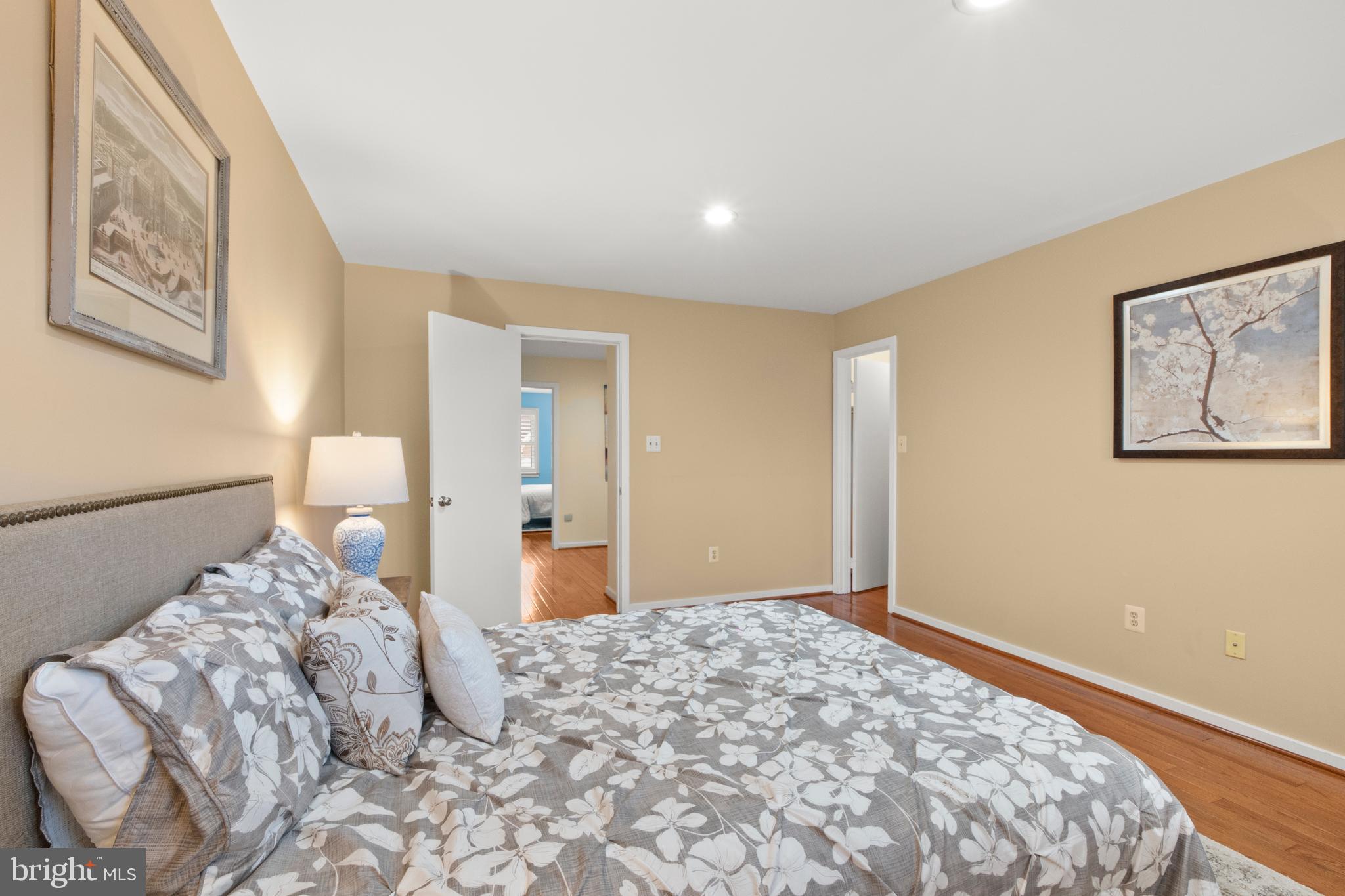 6315 Manchester Way Alexandria, VA 22312 - Photo 35 of 51 a bedroom with a large bed and a painting on the wall