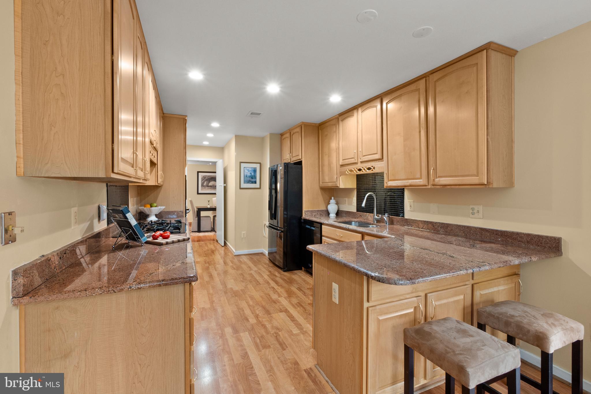 6315 Manchester Way Alexandria, VA 22312 - Photo 7 of 51 a kitchen with a refrigerator and a sink