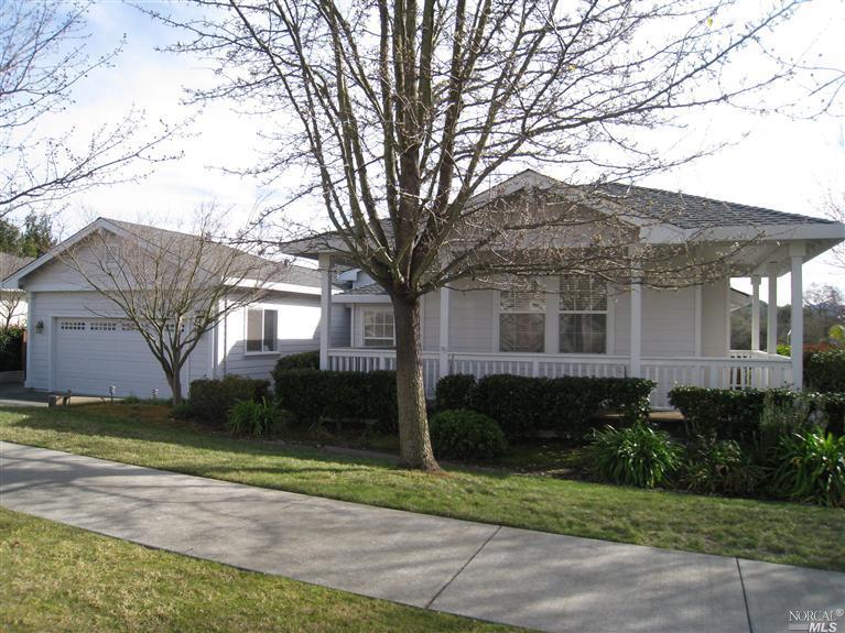 5704 Evening Way Santa Rosa, CA 95409 - Photo 1 of 1 a front view of a house with a yard and garage