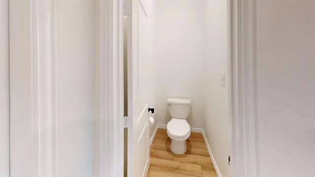a bathroom with a toilet and a sink