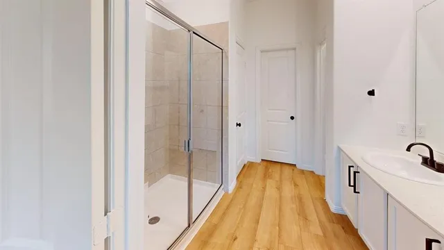 a bathroom with a tub and shower