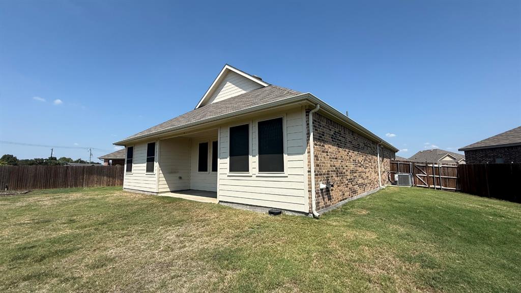 749 Twinvale Drive Princeton, TX 75407 - Photo 20 of 23 a view of a house with a yard