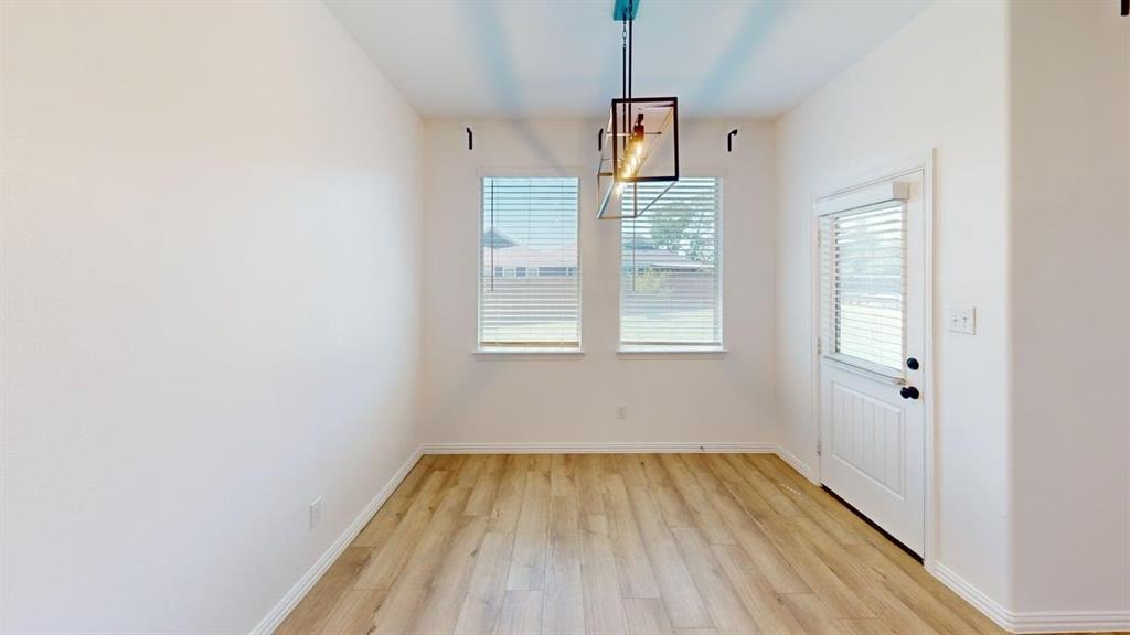749 Twinvale Drive Princeton, TX 75407 - Photo 7 of 23 a view of empty room with wooden floor and fan