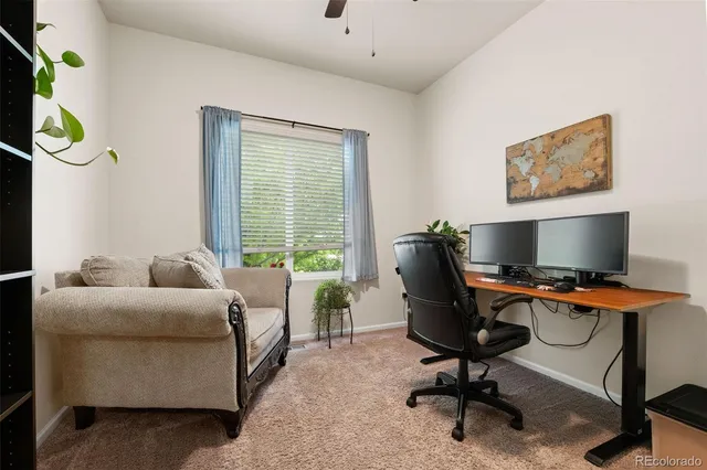 a bedroom with a workspace