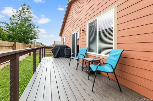 a view of chairs on deck with wooden floor