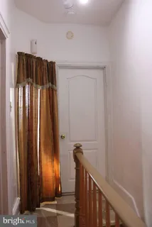 a view of a entryway with wooden walls